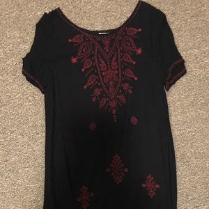 Black babydoll dress with maroon design.